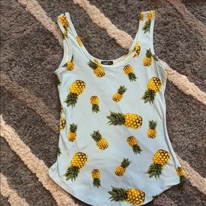 A cute baby blue tank top with pineapples